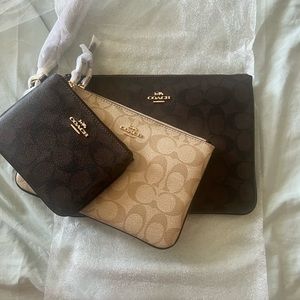 Brand new coach trio wristlet/ wallets